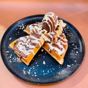 Kinder Egg waffle with milk and white chocolate sauce
